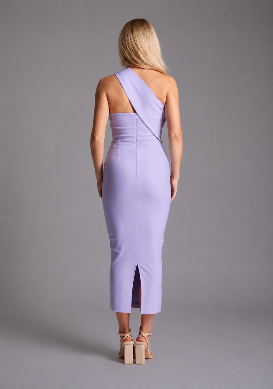 Vesper lilac one shoulder midaxi dress with asymmetric neckline and fitted silhouette, back view on blonde model against grey studio background.