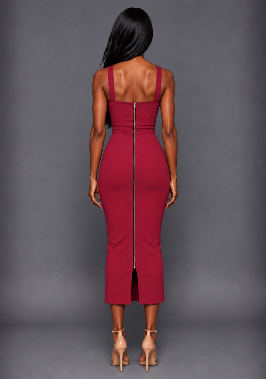 Back image of a model wearing the VSPR Hudson Cross Strap Bodycon Raspberry Midaxi Dress, showcasing the clean back finish, concealed zip and sleek silhouette against a grey studio backdrop