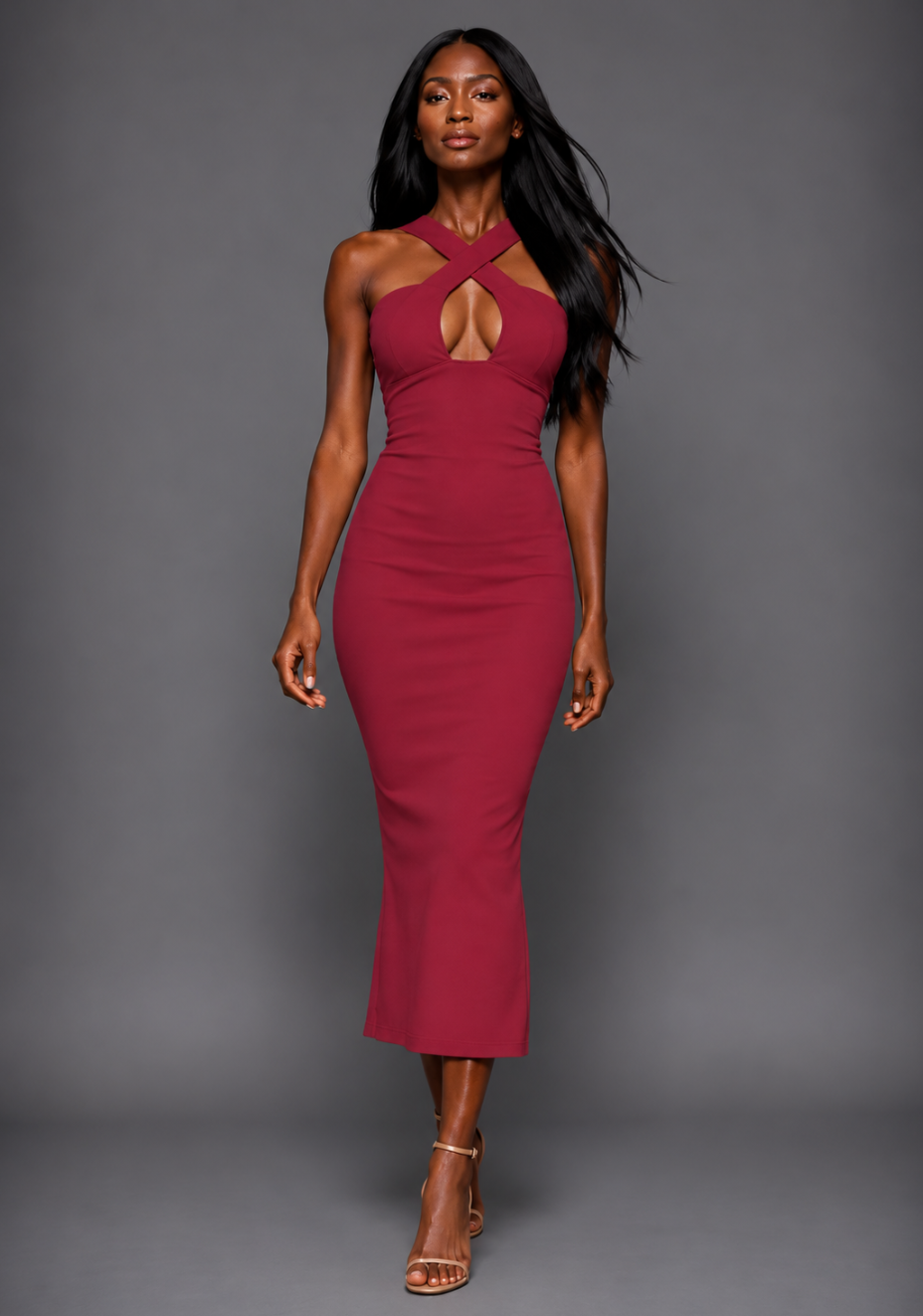 Front image of a model wearing the VSPR Hudson Bodycon Raspberry Midaxi Dress from the front, highlighting its bold raspberry colour, cross strap neckline and elegant midaxi length against a grey studio backdrop.
