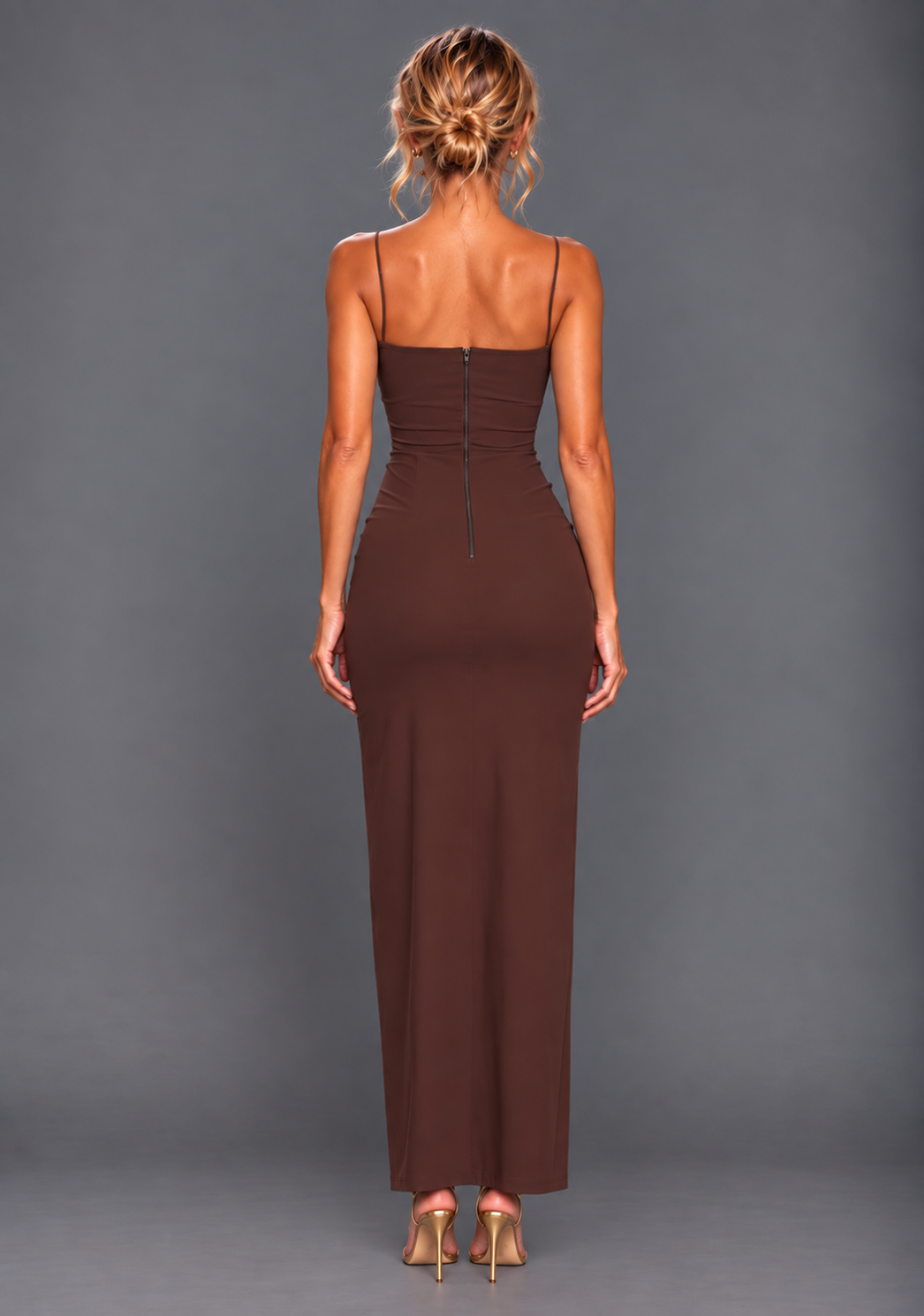 Back image of a model wearing the VSPR Suki Cami Strap Cup Detail Chocolate Maxi Dress, showcasing the clean back finish, concealed zip and graceful maxi silhouette against a grey studio backdrop.