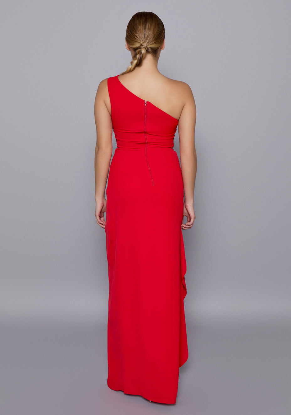 Back view of the VSPR Stella One-Shoulder Dress featuring a clean zip closure and tailored fit, showcasing the smooth drape and refined open-back silhouette.