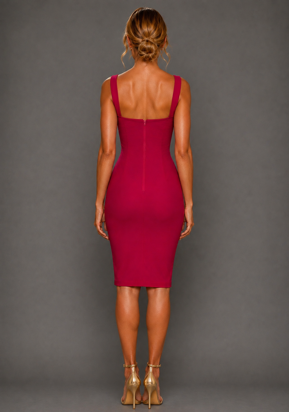 Back image of a model wearing the VSPR Zada Cerise Midi Dress, highlighting its streamlined pencil cut and sculpted body-skimming fit against a grey studio backdrop
