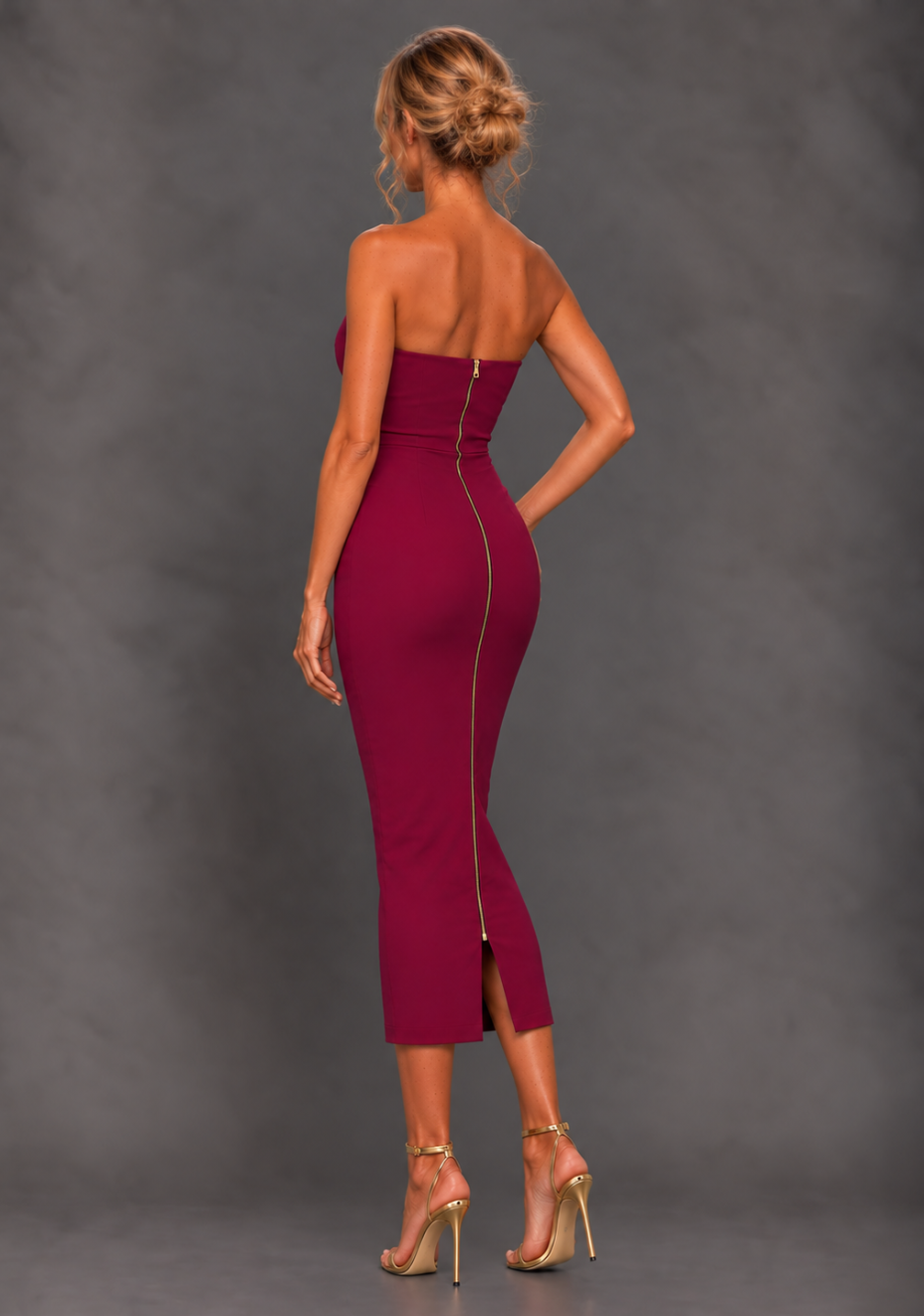 Side back image of a model wearing the VSPR Marion Sweetheart Neckline Berry Midaxi Dress, showcasing the sleek bodycon silhouette, centre gold back zip and smooth fit from the side against a grey studio backdrop.