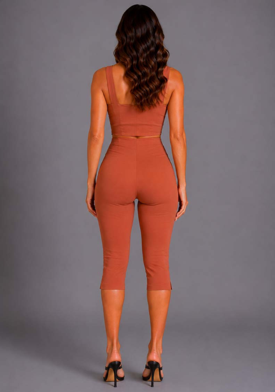 Back image of a model wearing the VSPR Mckenzie Square Neckline Rust Top, showcasing the clean back fitted silhouette and smooth finish against a grey studio backdrop.