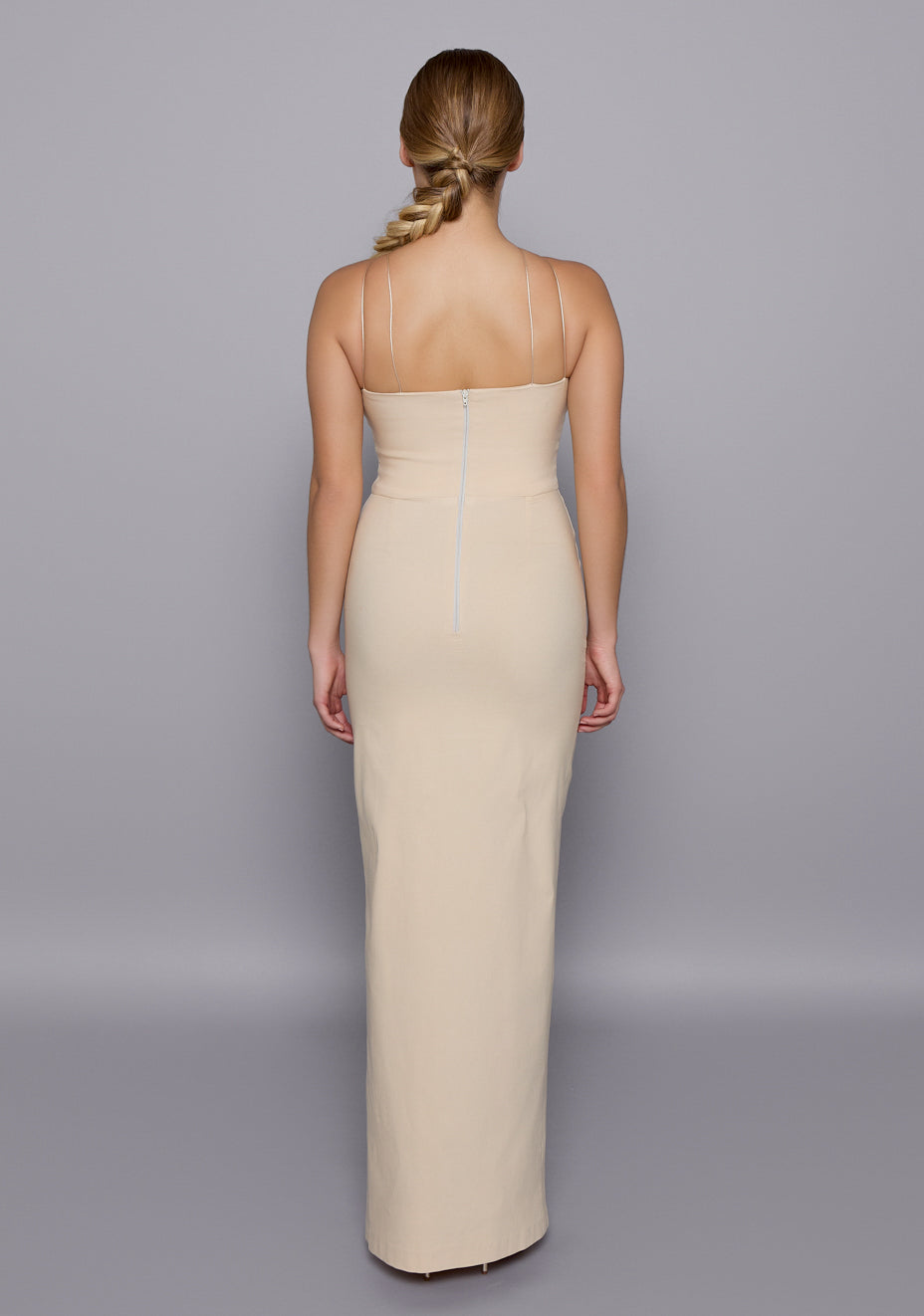 Back view of the VSPR Auralia Maxi Dress in Stone featuring clean zip closure, open-back cut framed by double-thin straps, and flattering contoured fit.