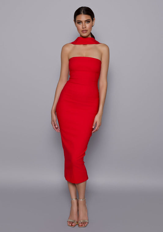 Model wearing the VSPR Dion Red Midaxi Dress featuring a structured halterneck collar, straight neckline, and bodycon fit, posed against a neutral studio backdrop.