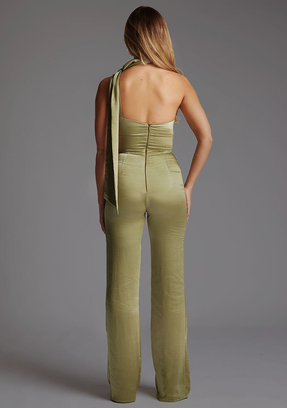 Back image of a model wearing the VSPR Juniper Halter Pine Green High-Neck Top on a model, highlighting the elegant back design and sophisticated high-neck style.