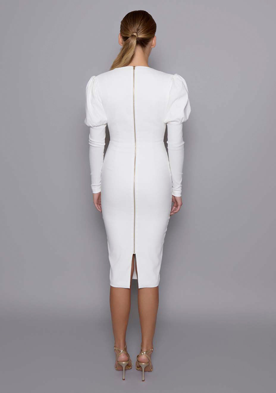 Back view of the VSPR Lyra ivory midi dress showcasing gold zip closure, sleek fitted back, and clean seam lines, styled with matching Seraphina lace lingerie subtly visible beneath.
