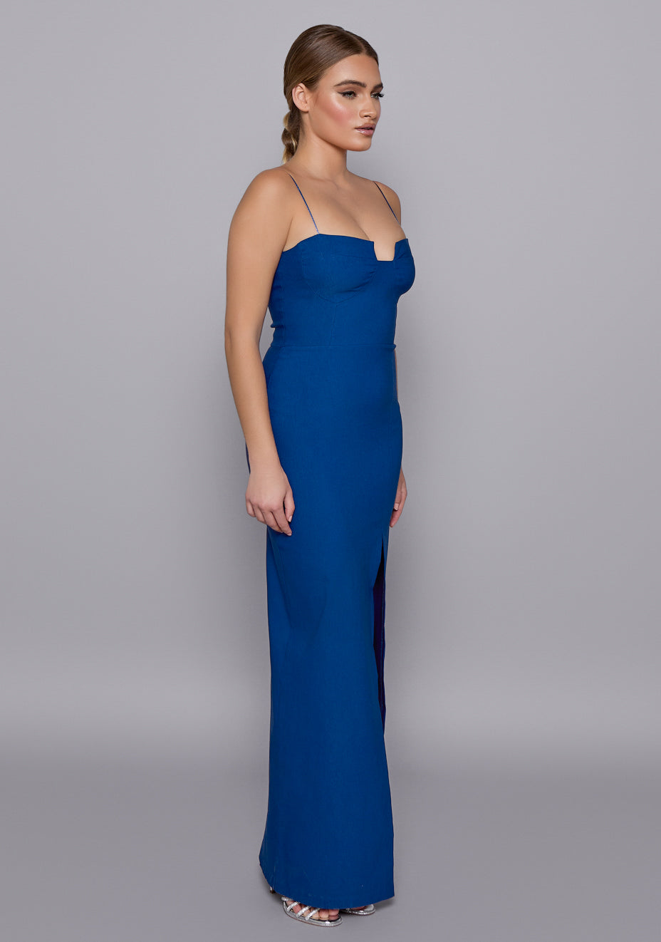 Full-length view of the Suki cobalt maxi dress with a structured sweetheart neckline, body-skimming silhouette and elegant front split.