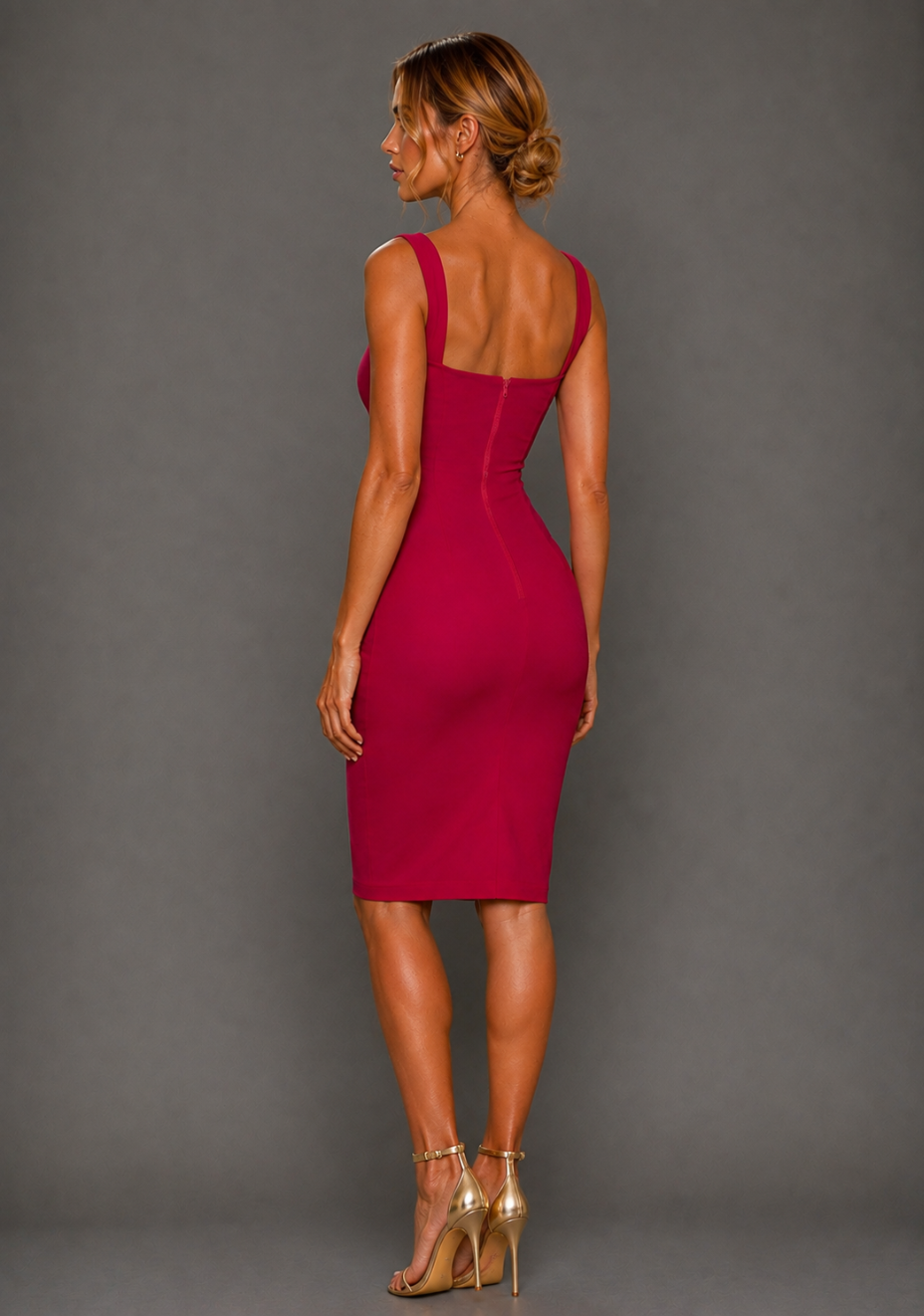 Side back image of a model wearing the VSPR Zada Square Neck Cerise Midi Dress, highlighting the sleek sculpted silhouette and fitted midi length against a grey studio backdrop